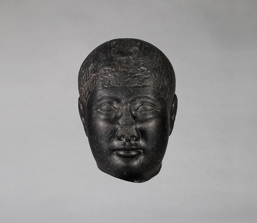 Head from a Statue with Magical Texts